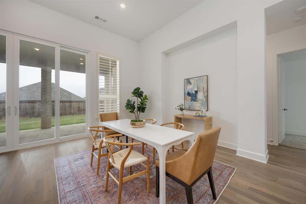 1303 Limestone Ridge Road Mansfield, TX 76063 - Photo 12 of 34 The fining room offers a view of the backyard and a lot of natural light. Notice the sliding doors to the patio!