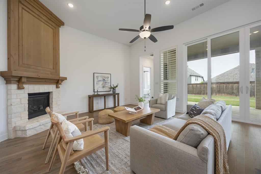 1303 Limestone Ridge Road Mansfield, TX 76063 - Photo 14 of 34 The fireplace offers the same Knotty Alder wood as noted in the kitchen and bar.
