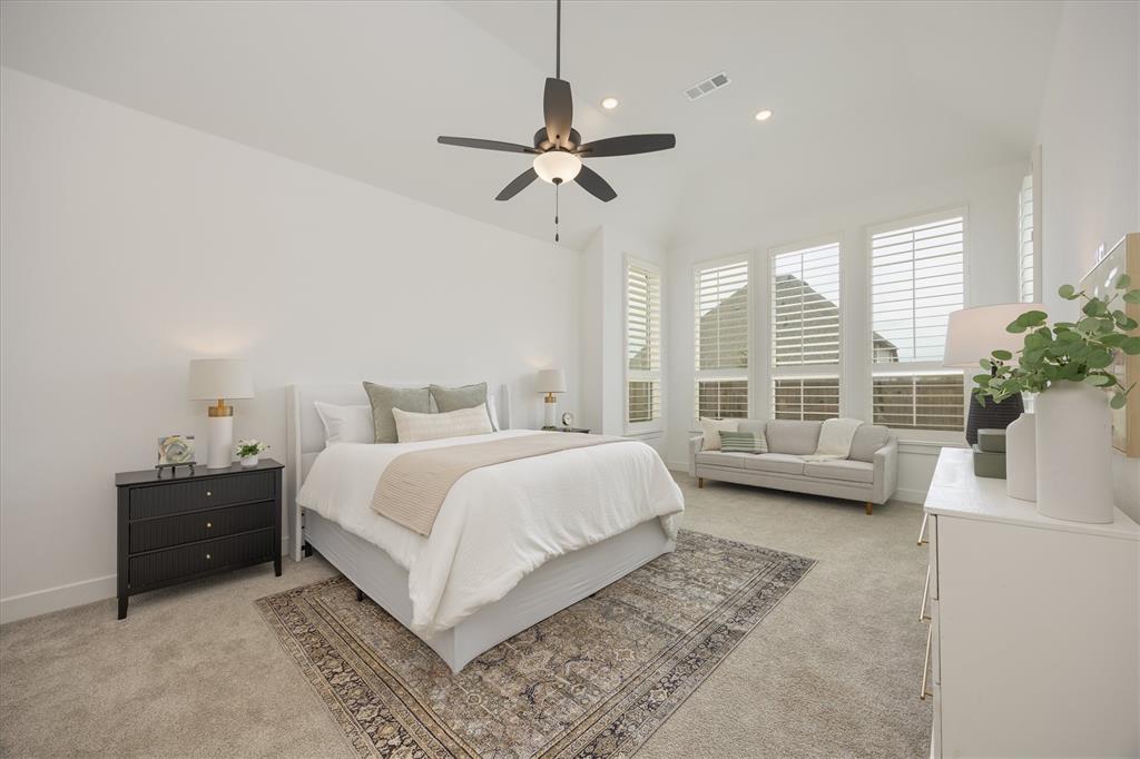 1303 Limestone Ridge Road Mansfield, TX 76063 - Photo 18 of 34 This exquisite primary suite offers an abundance of space, allowing for both relaxation and rejuvenation. The room is bathed in natural light, creating a bright and airy atmosphere.
