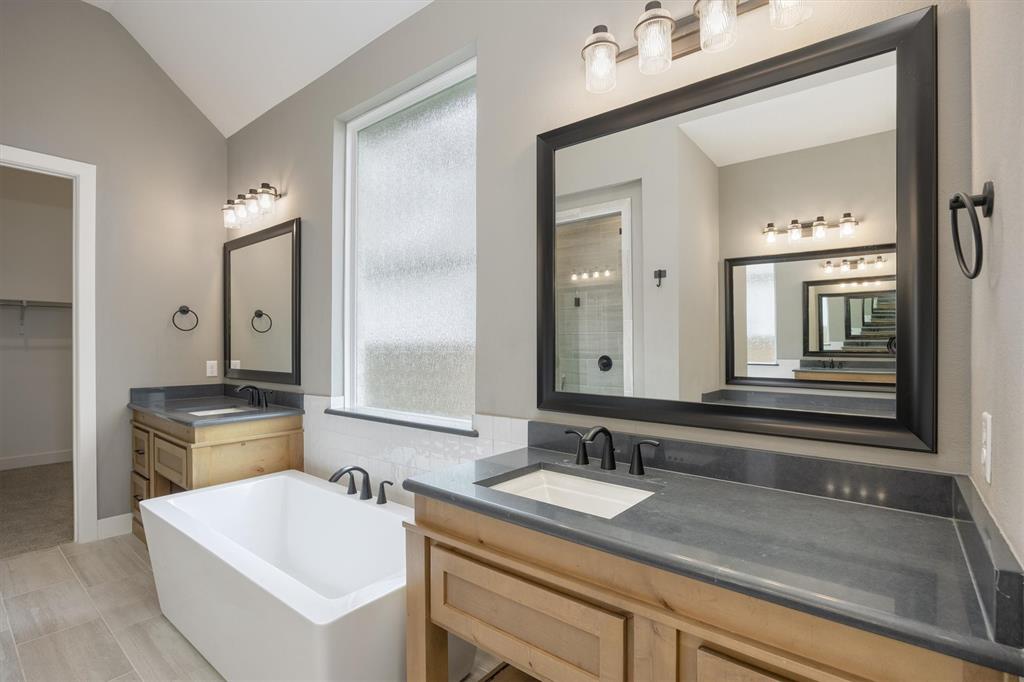 1303 Limestone Ridge Road Mansfield, TX 76063 - Photo 20 of 34 His and her vanities and a free-standing tub make for easier mornings with your significante other!