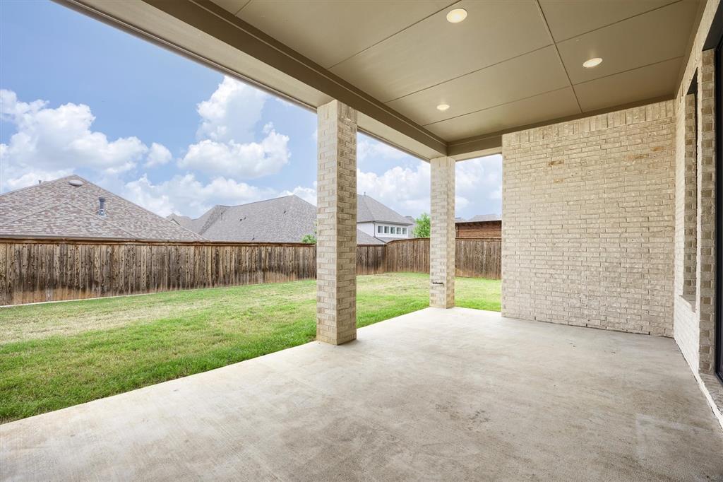 1303 Limestone Ridge Road Mansfield, TX 76063 - Photo 27 of 34 Spacious patio and nicely sized yard!