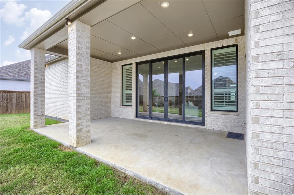 1303 Limestone Ridge Road Mansfield, TX 76063 - Photo 28 of 34 Notice the sliding doors. They would be perfect to open and entertain on a fine spring evening!
