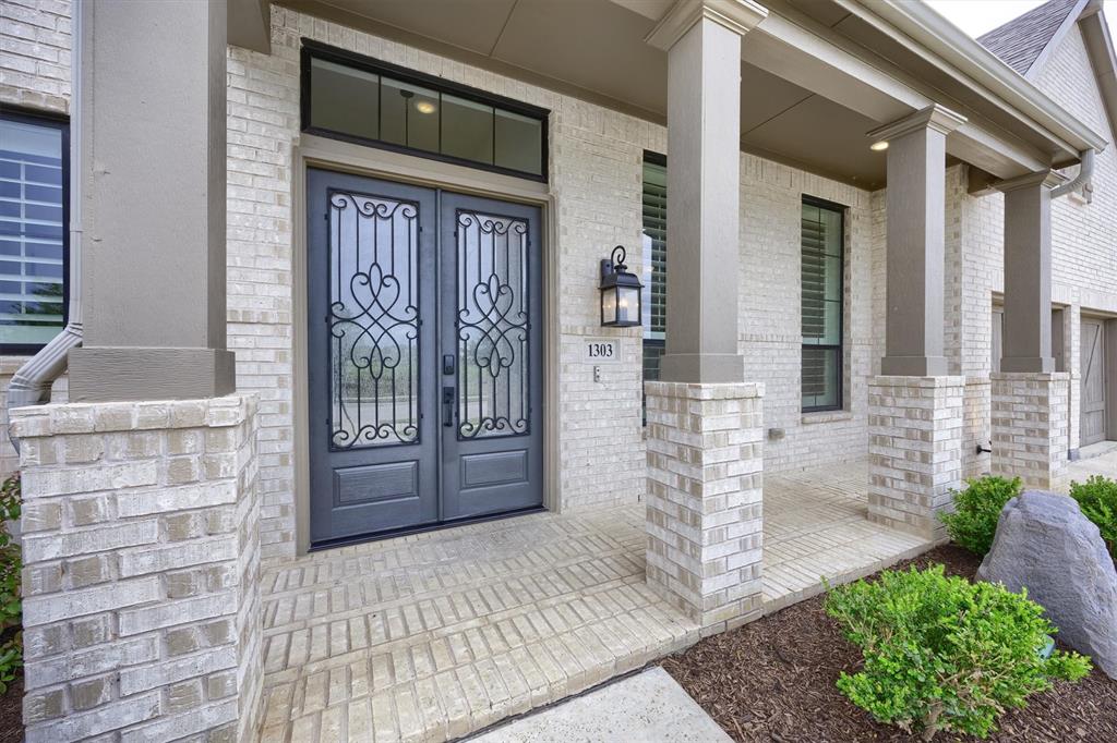 1303 Limestone Ridge Road Mansfield, TX 76063 - Photo 4 of 34 Enjoy sitting on the front porch in the evenings while you gaze at the water and hang out with friends.