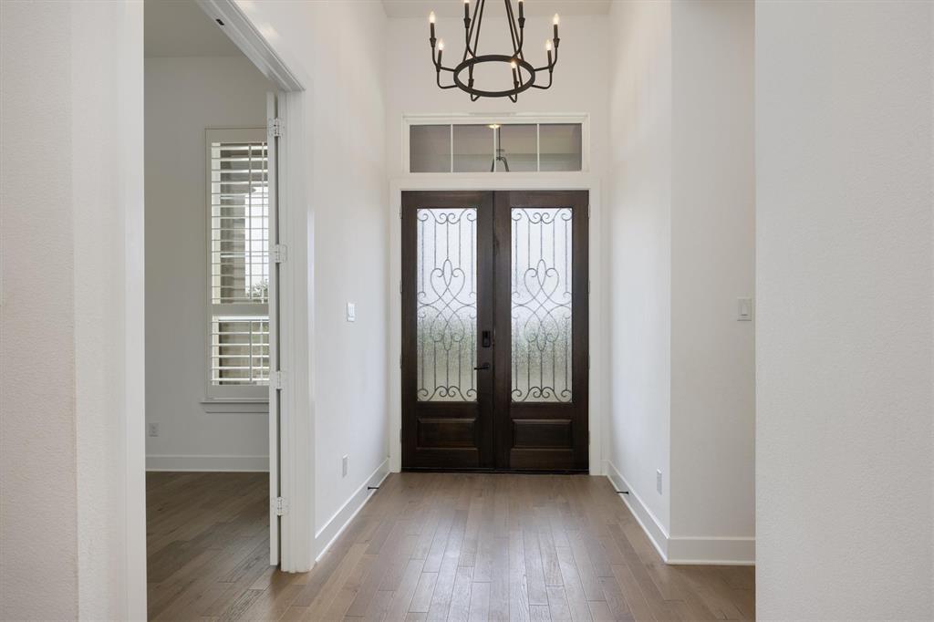1303 Limestone Ridge Road Mansfield, TX 76063 - Photo 5 of 34 Beautiful wood floors and a long entry.