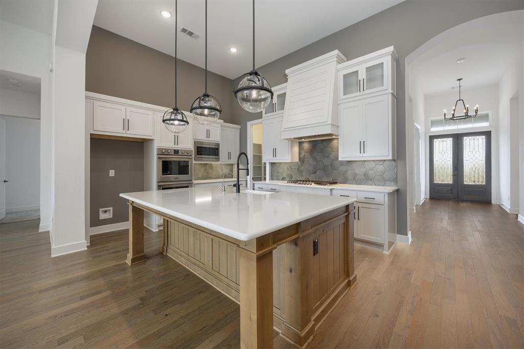 1303 Limestone Ridge Road Mansfield, TX 76063 - Photo 9 of 34 The kitchen is open to both the family and dining area.