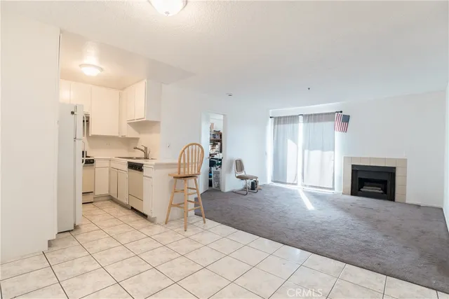 a view of kitchen with furniture and fireplace