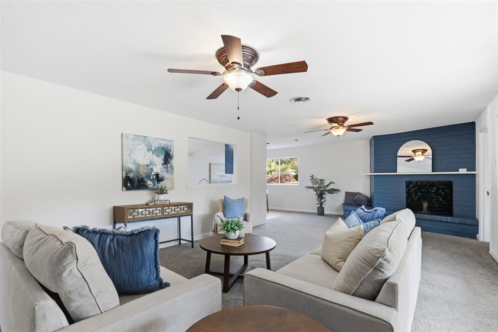 2212 Briardale Road Fort Worth, TX 76119 - Photo 2 of 25 a living room with furniture and a fireplace