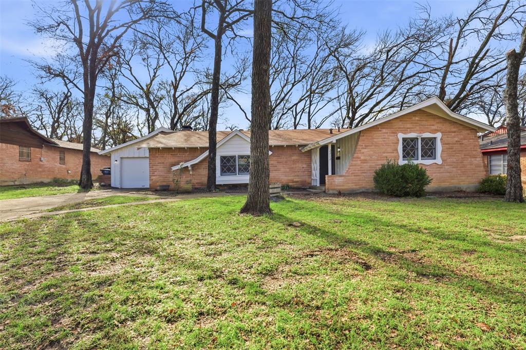2212 Briardale Road Fort Worth, TX 76119 - Photo 21 of 25 a front view of house with yard and green space
