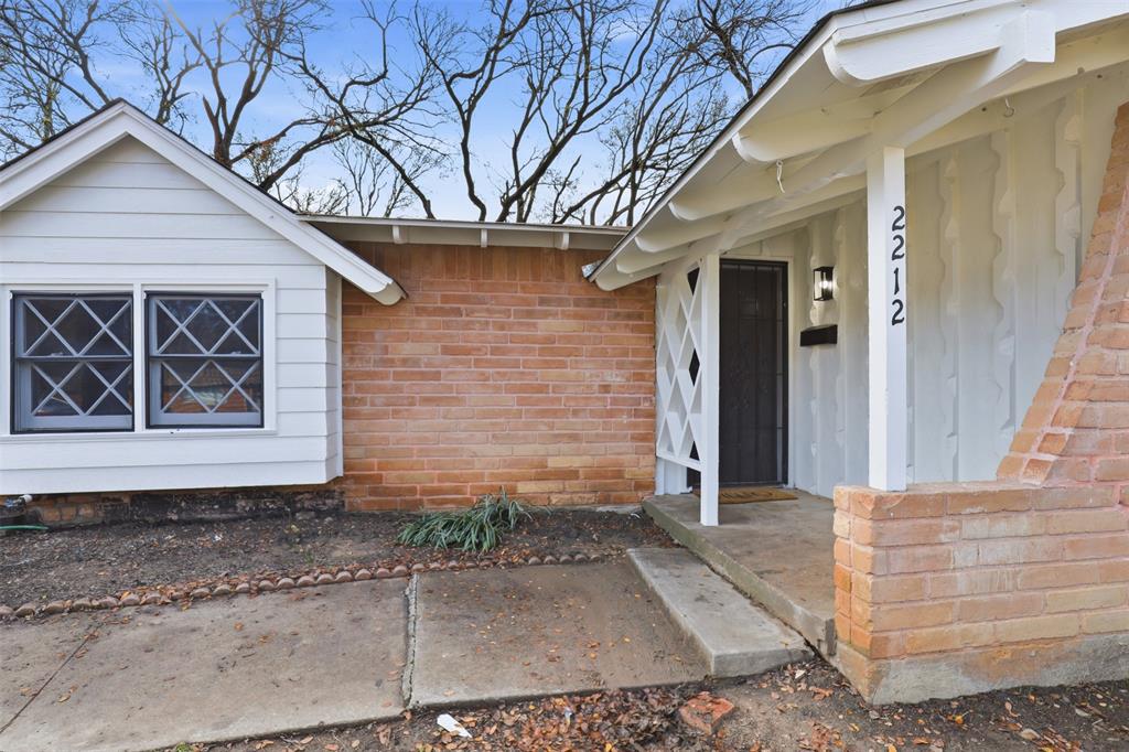 2212 Briardale Road Fort Worth, TX 76119 - Photo 22 of 25 a front view of a house with parking