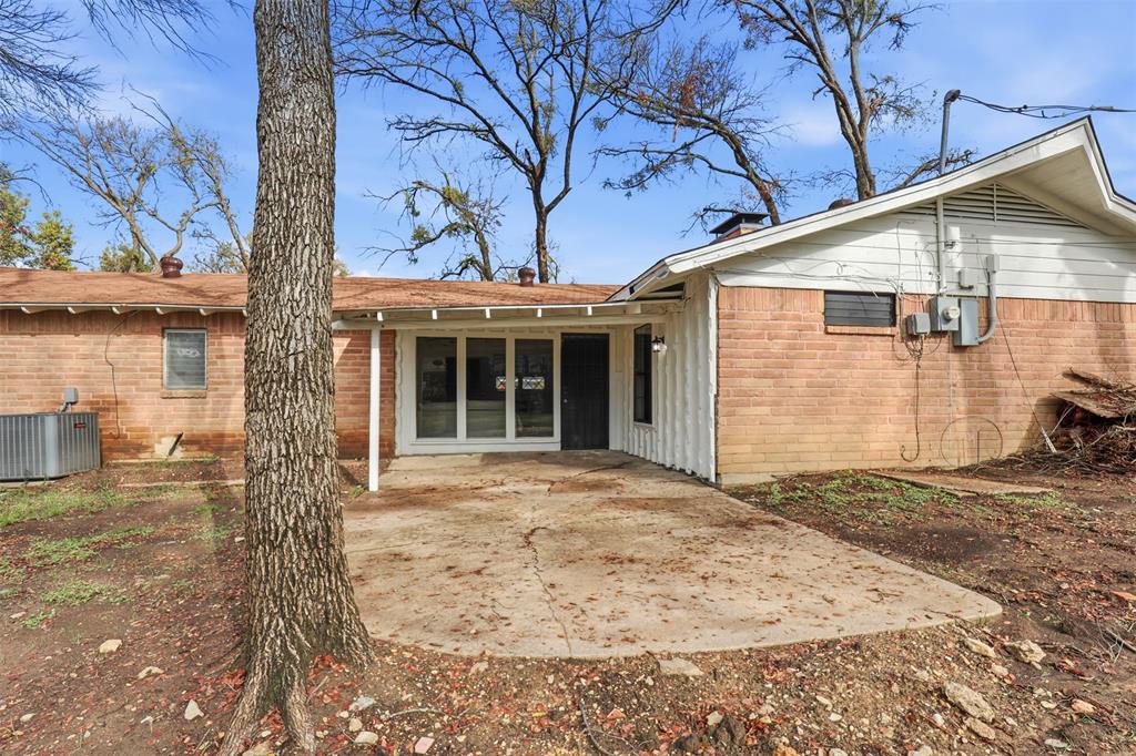 2212 Briardale Road Fort Worth, TX 76119 - Photo 23 of 25 a view of a house with a yard
