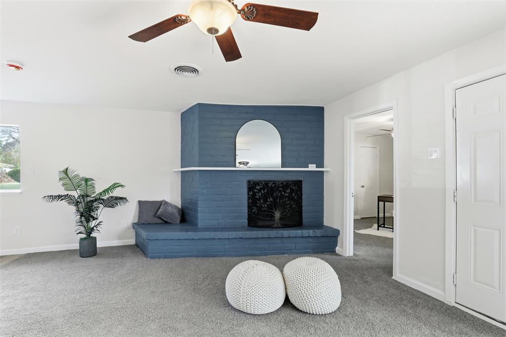 2212 Briardale Road Fort Worth, TX 76119 - Photo 5 of 25 a living room with furniture and a fireplace
