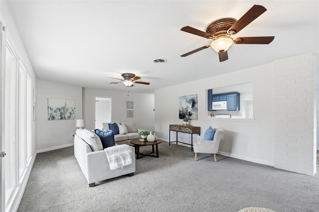2212 Briardale Road Fort Worth, TX 76119 - Photo 6 of 25 a living room with furniture and a ceiling fan