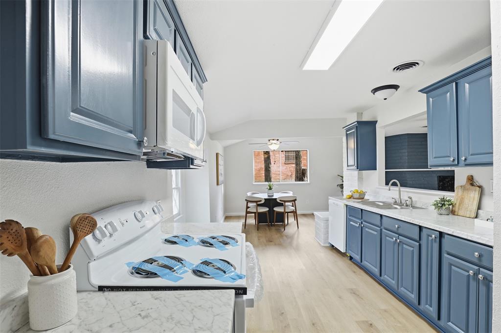2212 Briardale Road Fort Worth, TX 76119 - Photo 10 of 25 a living room with furniture and wooden floor