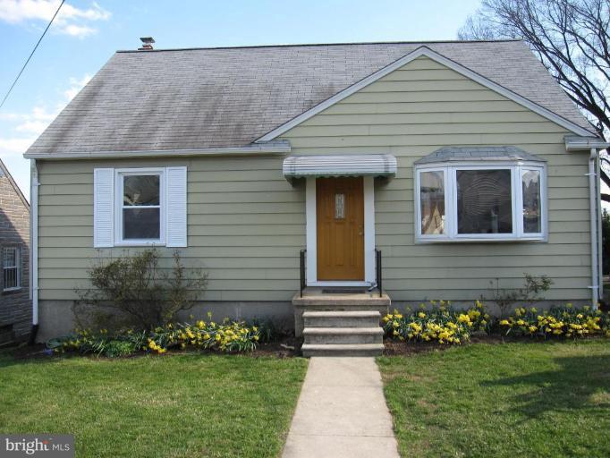 7917 34th Street Rosedale, MD 21237 - Photo 1 of 23 a front view of a house with a yard