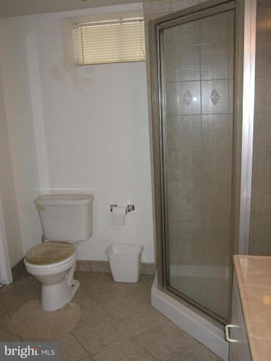 7917 34th Street Rosedale, MD 21237 - Photo 11 of 23 a bathroom with a toilet and a shower