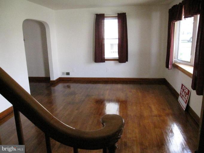 7917 34th Street Rosedale, MD 21237 - Photo 12 of 23 wooden floor in an empty room with a window