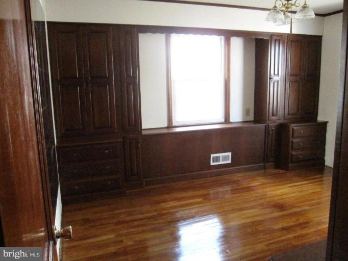 7917 34th Street Rosedale, MD 21237 - Photo 16 of 23 a view of a kitchen with wooden floor and a window