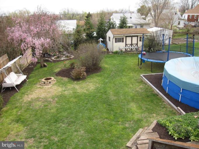 7917 34th Street Rosedale, MD 21237 - Photo 19 of 23 a view of a house with backyard sitting area and garden