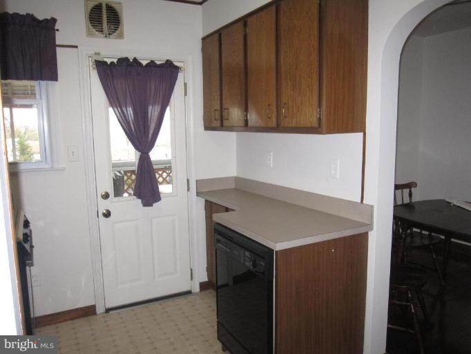 7917 34th Street Rosedale, MD 21237 - Photo 22 of 23 a kitchen with a refrigerator and a sink