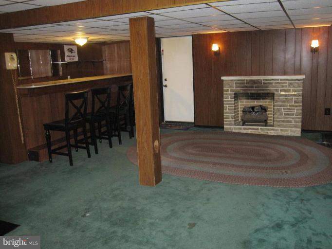 7917 34th Street Rosedale, MD 21237 - Photo 8 of 23 a view of livingroom with furniture and fireplace
