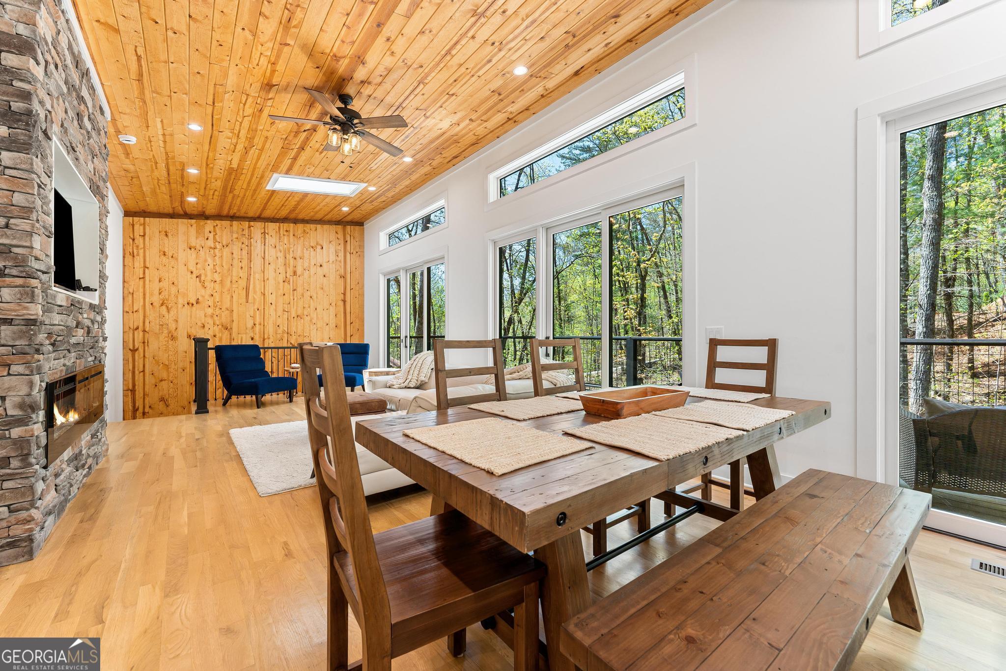 150 Clarice Lane Sautee Nacoochee, GA 30571 - Photo 21 of 42 a view of a dining room with furniture window and wooden floor