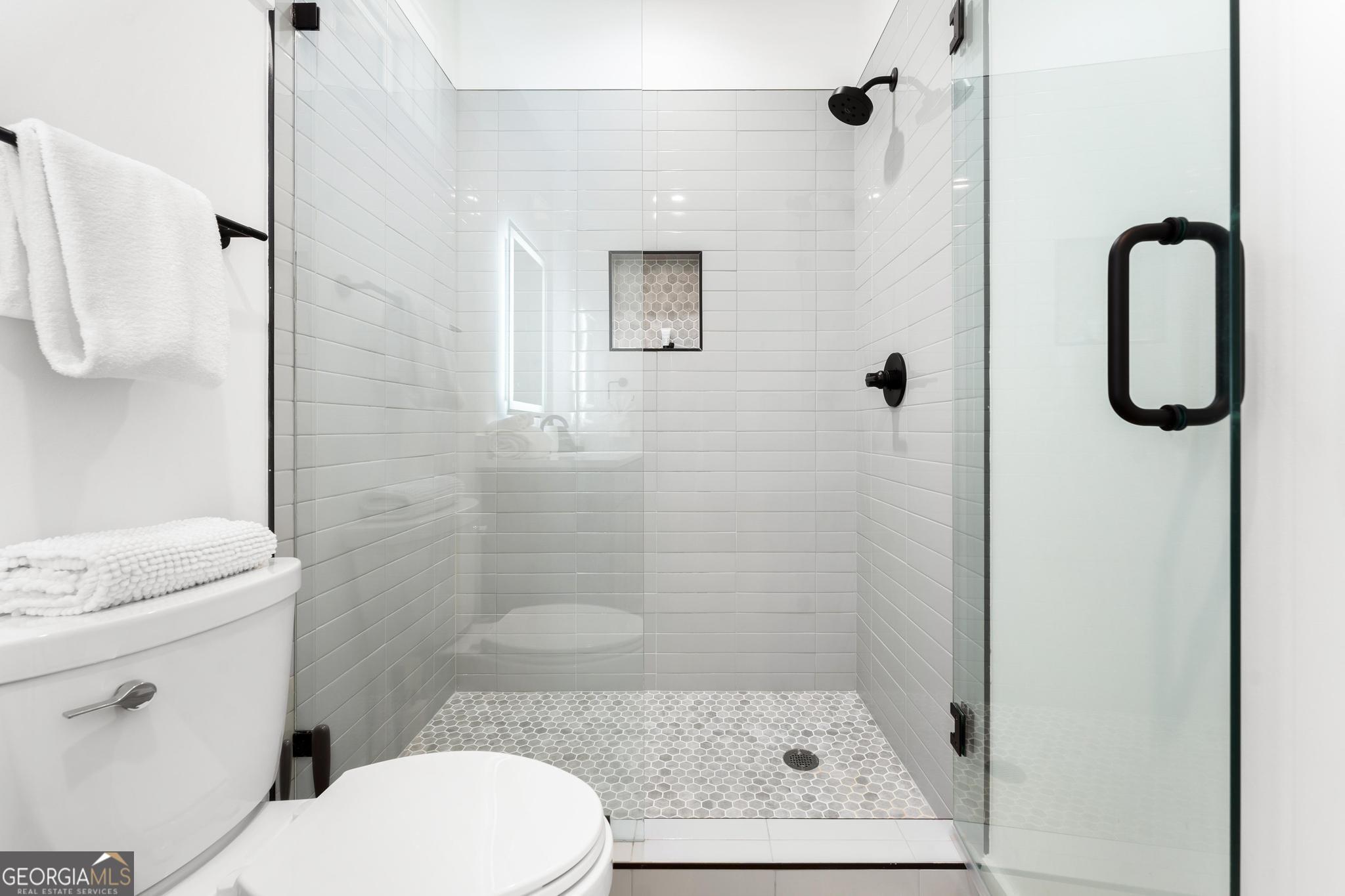 150 Clarice Lane Sautee Nacoochee, GA 30571 - Photo 26 of 42 a bathroom with a toilet sink and shower