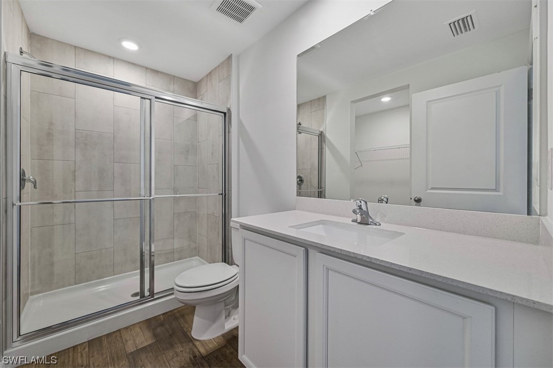 830 General Chesty Puller Court LaBelle, FL 33935 - Photo 14 of 21 a bathroom with a granite countertop sink toilet and shower