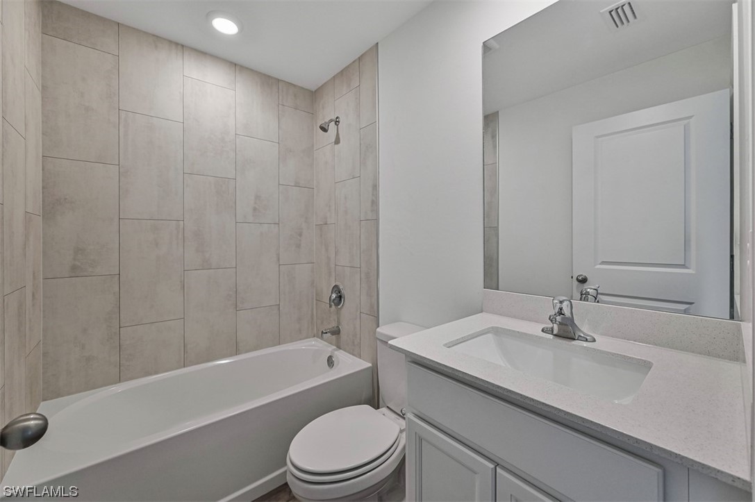 830 General Chesty Puller Court LaBelle, FL 33935 - Photo 18 of 21 a bathroom with a sink a toilet and bathtub