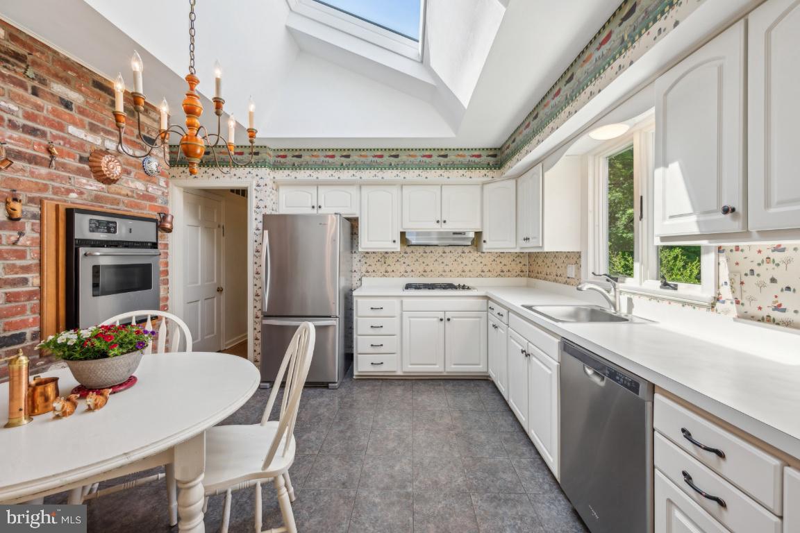 2 Wagon Bridge Run Moorestown, NJ 08057 - Photo 13 of 23 a kitchen with kitchen island granite countertop a sink cabinets stainless steel appliances and a window