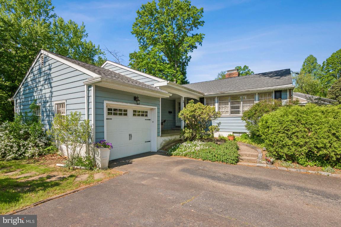 2 Wagon Bridge Run Moorestown, NJ 08057 - Photo 4 of 23 a front view of a house with a garden