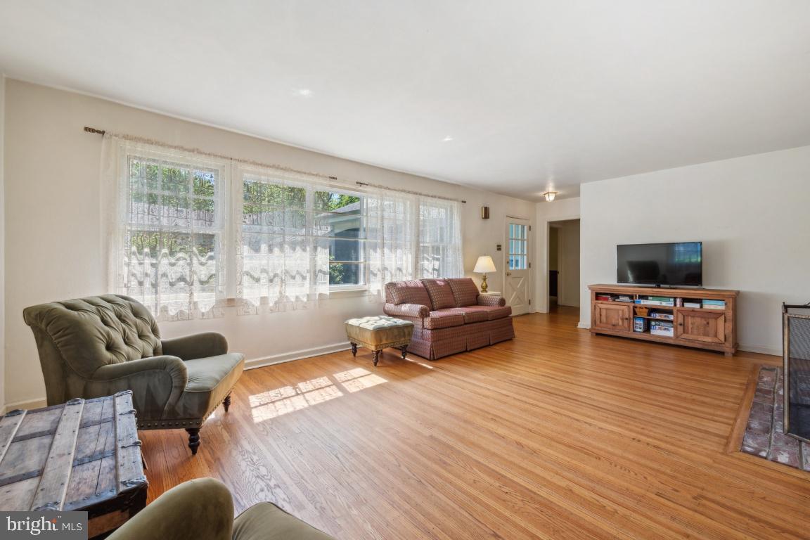2 Wagon Bridge Run Moorestown, NJ 08057 - Photo 8 of 23 a living room with furniture and a flat screen tv