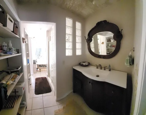 a en suite bathroom with a sink and a mirror