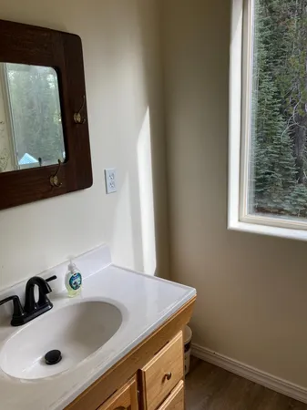 a bathroom with a sink and a mirror