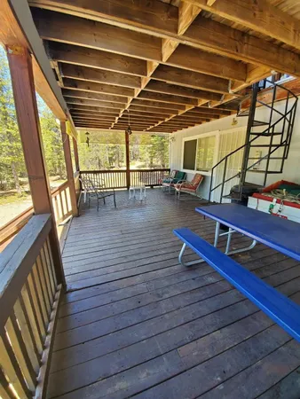 a view of a balcony with wooden floor