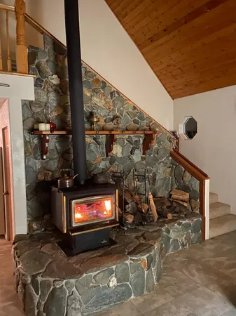 a living room with a fireplace furniture and a flat screen tv