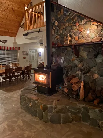 a view of a chairs and table in backyard
