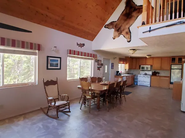 a view of a dining room with furniture window and outside view