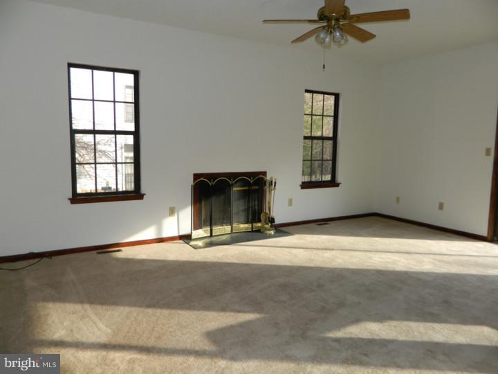 25 Blue Grass Road Clementon, NJ 08021 - Photo 11 of 25 an empty room with windows and fireplace