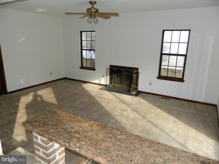 25 Blue Grass Road Clementon, NJ 08021 - Photo 12 of 25 an empty room with windows and fireplace