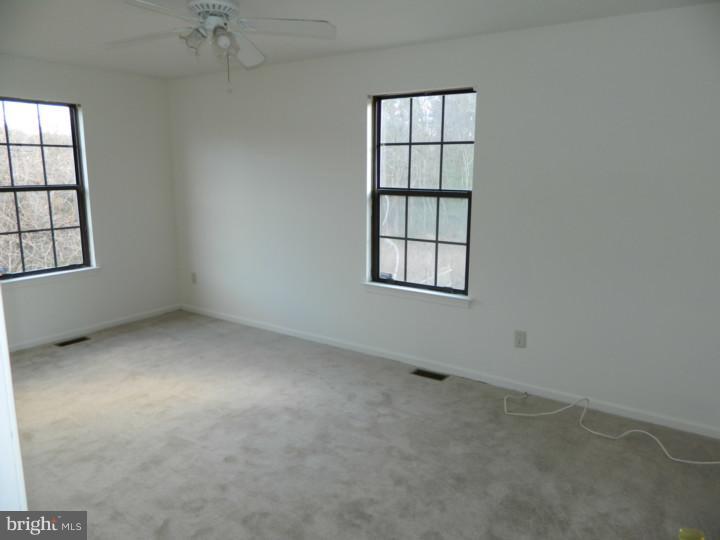 25 Blue Grass Road Clementon, NJ 08021 - Photo 16 of 25 an empty room with windows