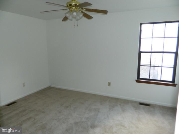 25 Blue Grass Road Clementon, NJ 08021 - Photo 17 of 25 an empty room with a window