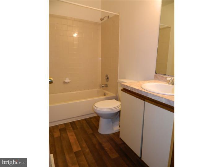 25 Blue Grass Road Clementon, NJ 08021 - Photo 18 of 25 a bathroom with a toilet a sink and a bathtub