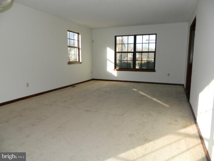 25 Blue Grass Road Clementon, NJ 08021 - Photo 4 of 25 an empty room with windows