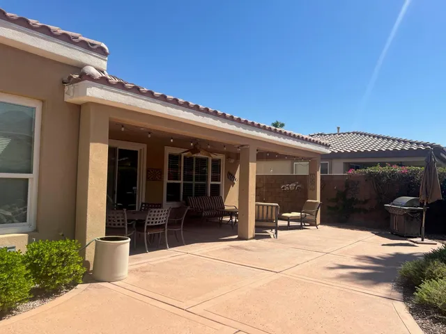 a view of a house with outdoor seating