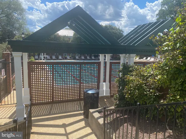 a view of a house with yard and patio
