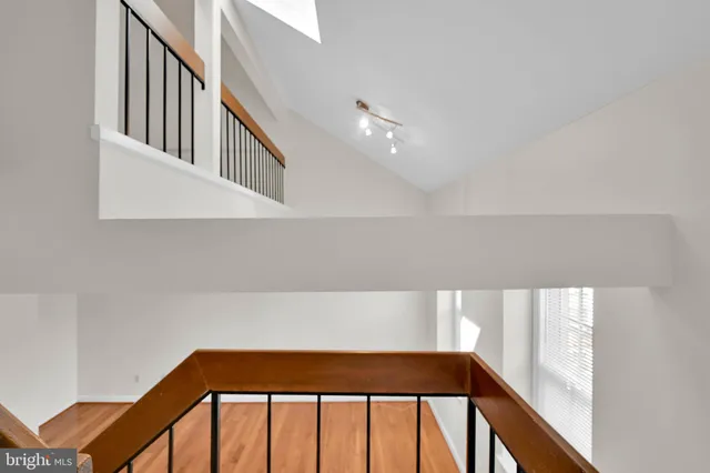 a view of staircase with wooden floor