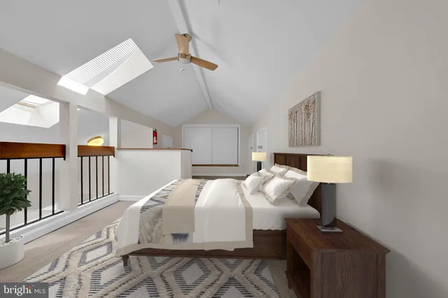 a bedroom with bed and a window