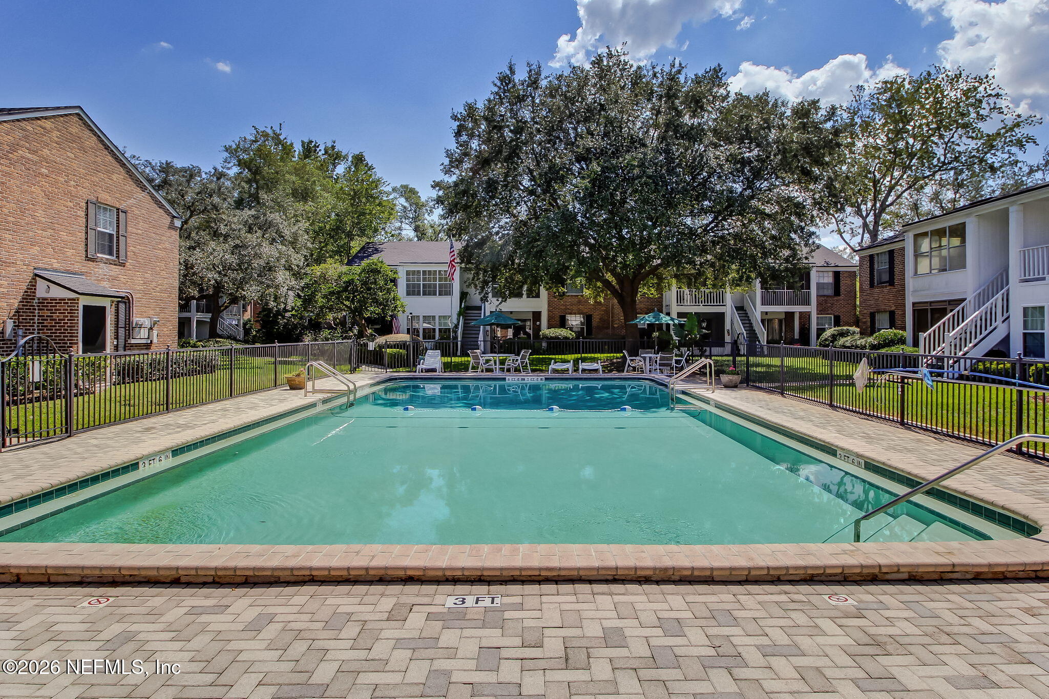 4358 Timuquana Road, Unit 134 Jacksonville, FL 32210 - Photo 25 of 31 a view of a house with a swimming pool and sitting area