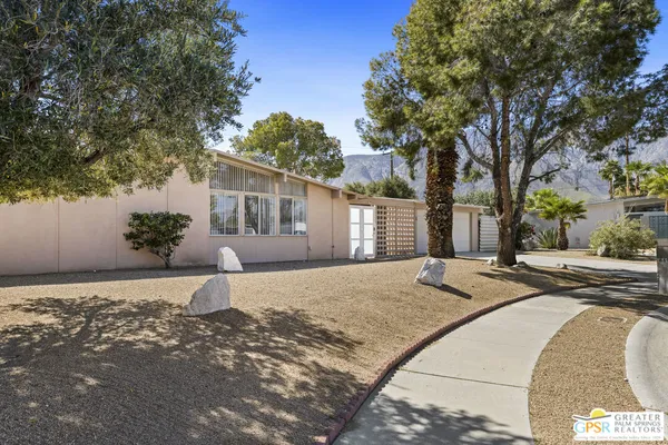 a view of a backyard of the house