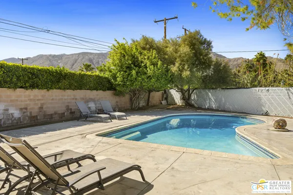 a view of a swimming pool with a patio